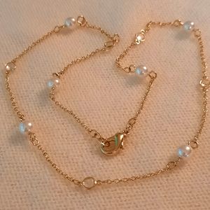Gold necklace with pearl and crystal beads